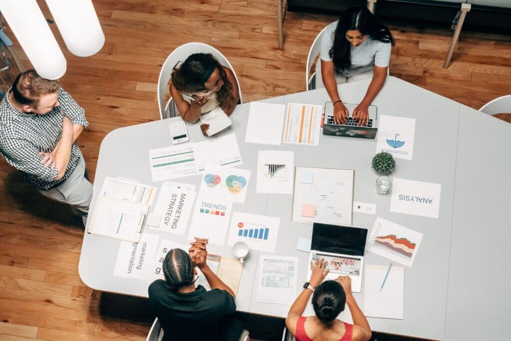 Colleagues planning a project together around a table